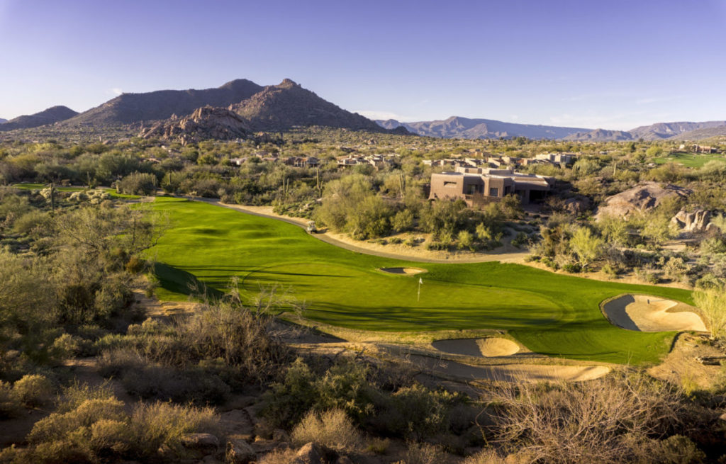 photo of Luxurious Golf Communities in Scottsdale AZ with the sun setting on a golf course